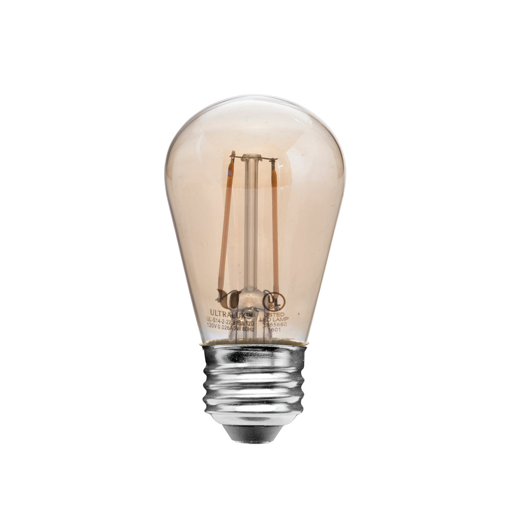 amber colored S14 light bulb on white background