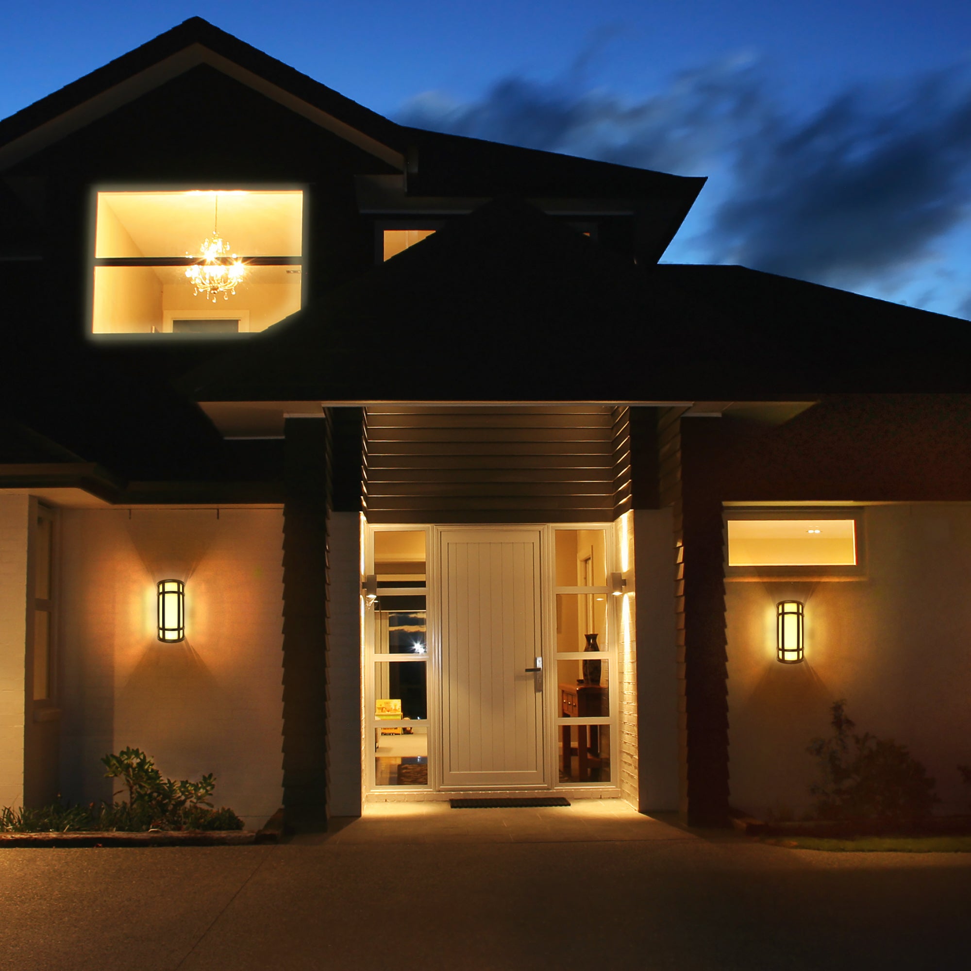black wall sconce being used on the outside of a house